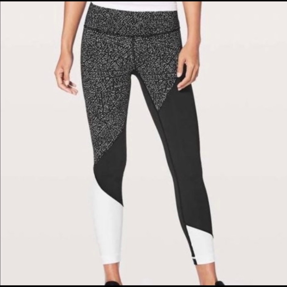 Lululemon Wunder Under polka dot white and black color block leggings.